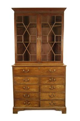 Appraisal: A George III mahogany bookcase cabinet the moulded and fluted