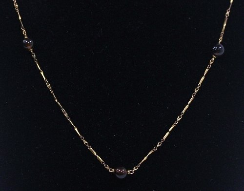 Appraisal: A ct gold and smoky quartz bead necklace the fetter-and-three