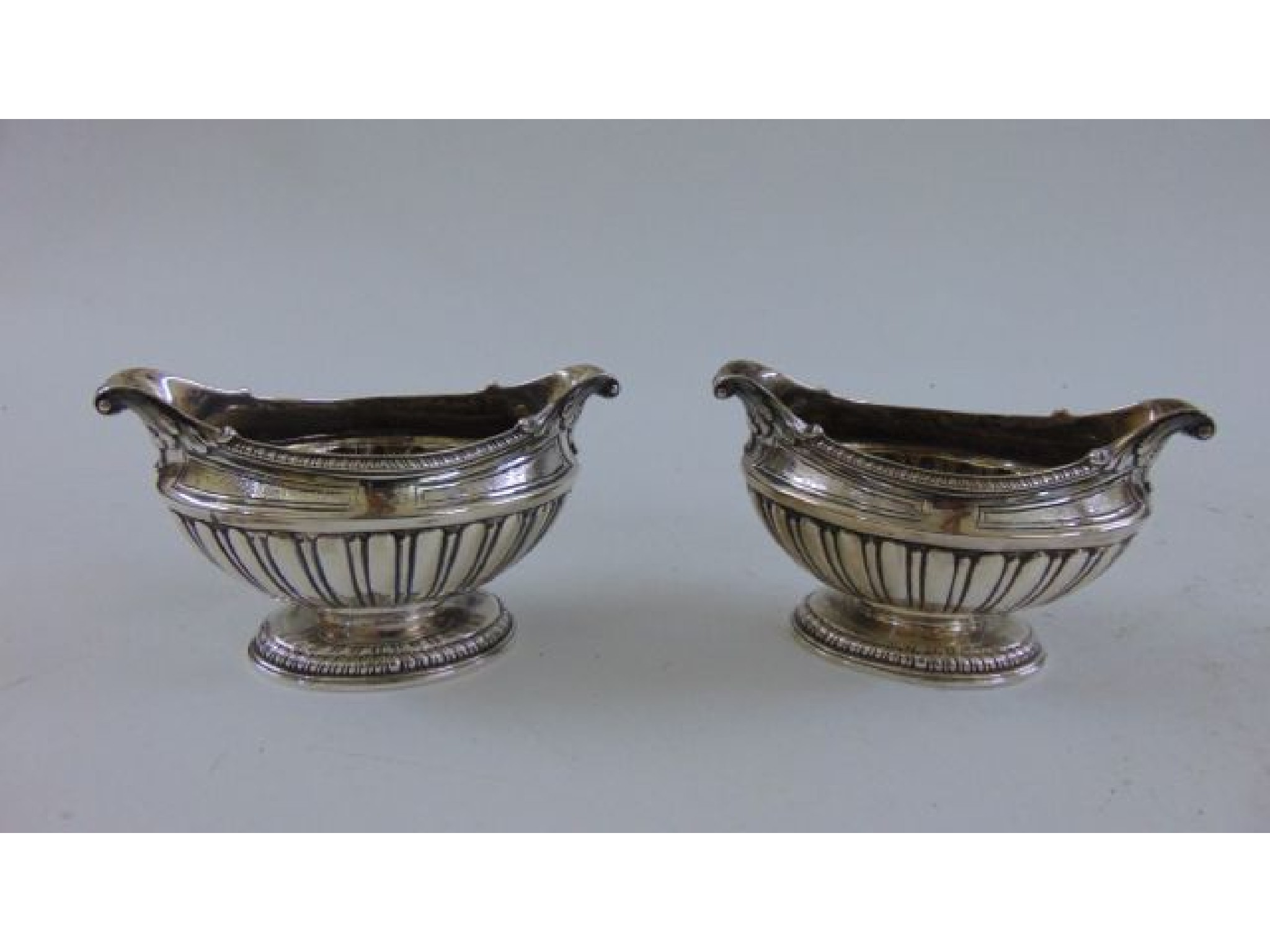 Appraisal: A pair of George III silver salt cellars probably Phineas