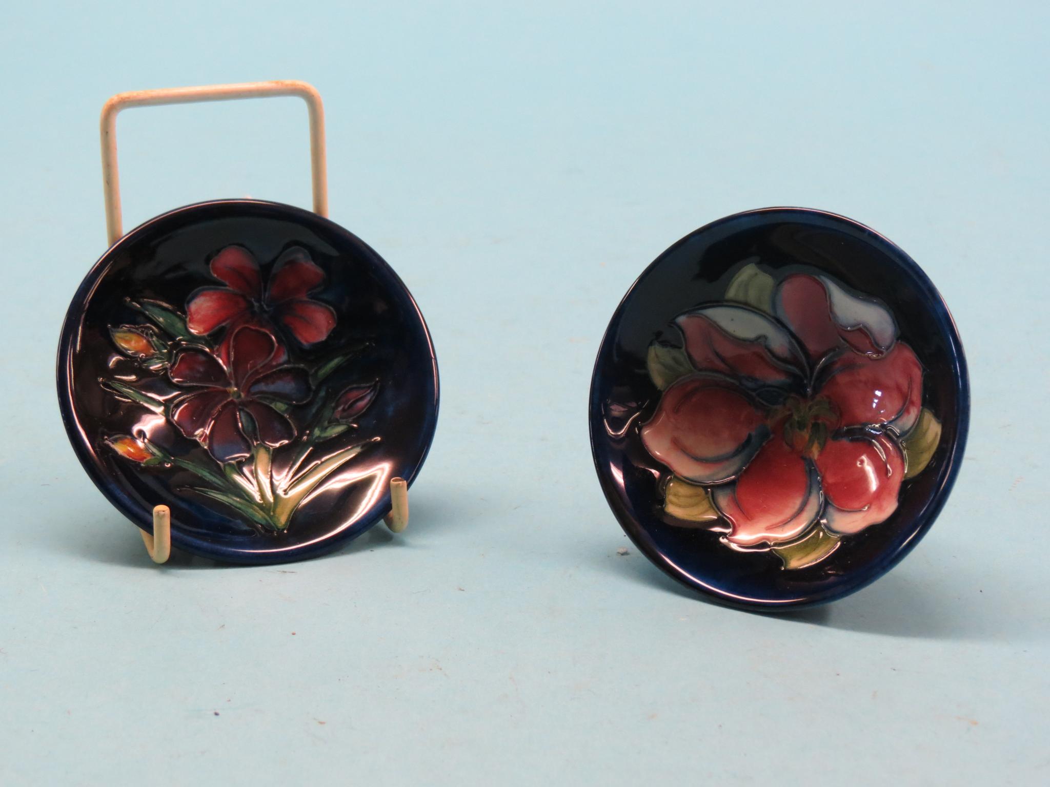 Appraisal: Two small Moorcroft dishes bright plants against a deep blue