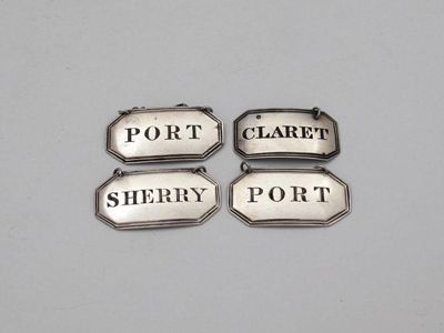 Appraisal: A set of three George III Scottish silver wine labels