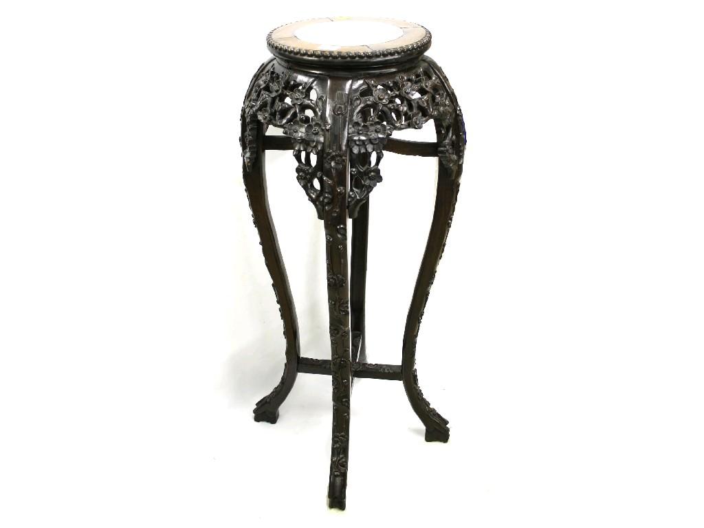 Appraisal: th century Chinese hardwood urn stand the pink marble and