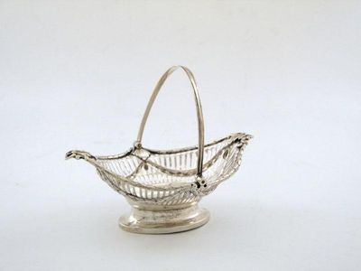 Appraisal: A George III silver swing-handled epergne basket oval form pierced