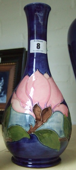 Appraisal: A Moorcroft vase decorated in the hibiscus pattern against a