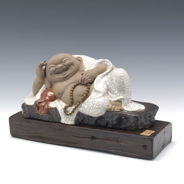 Appraisal: CHINESE CERAMIC RECLINING LAUGHING BUDDHA ON WOOD BASE x x