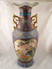 Appraisal: A large Oriental vase with gilt handles undulating broad rim