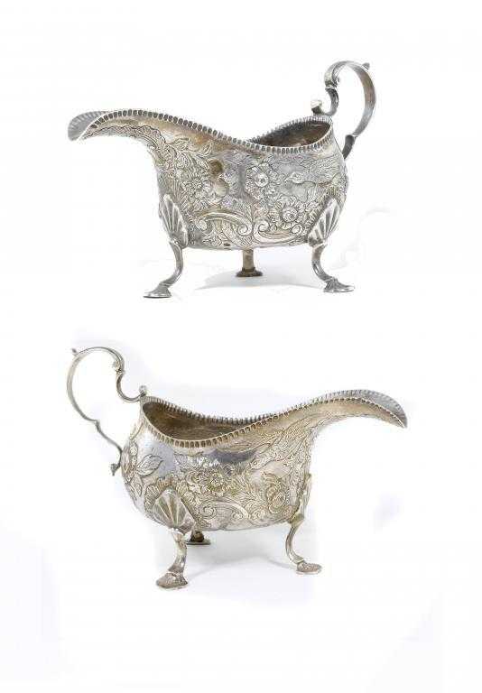 Appraisal: A PAIR OF GEORGE V SAUCE BOATS in th c