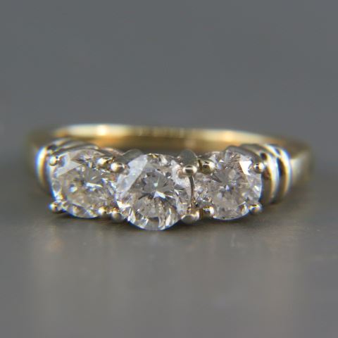 Appraisal: Diamond Ring a trio of round diamonds totaling carats k