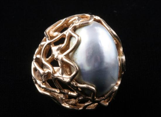 Appraisal: K YELLOW GOLD AND SILVER MABE PEARL DOME RING Oval