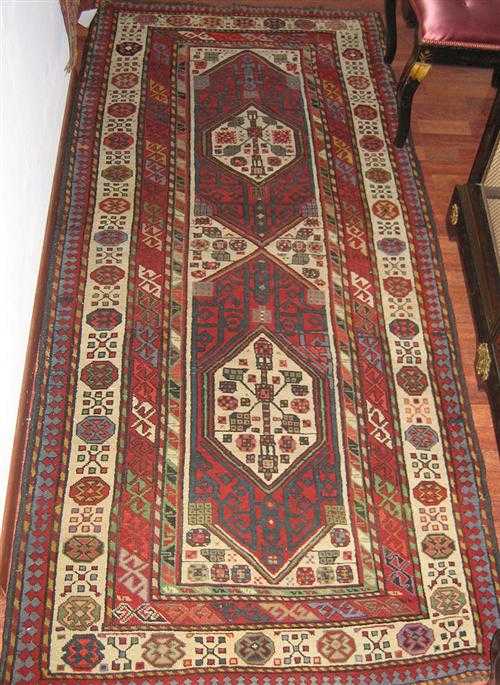 Appraisal: TALISH old White ground with two medallions in red and