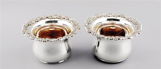 Appraisal: Pair silverplate wine coasters floral rim on deep-sided bowl with