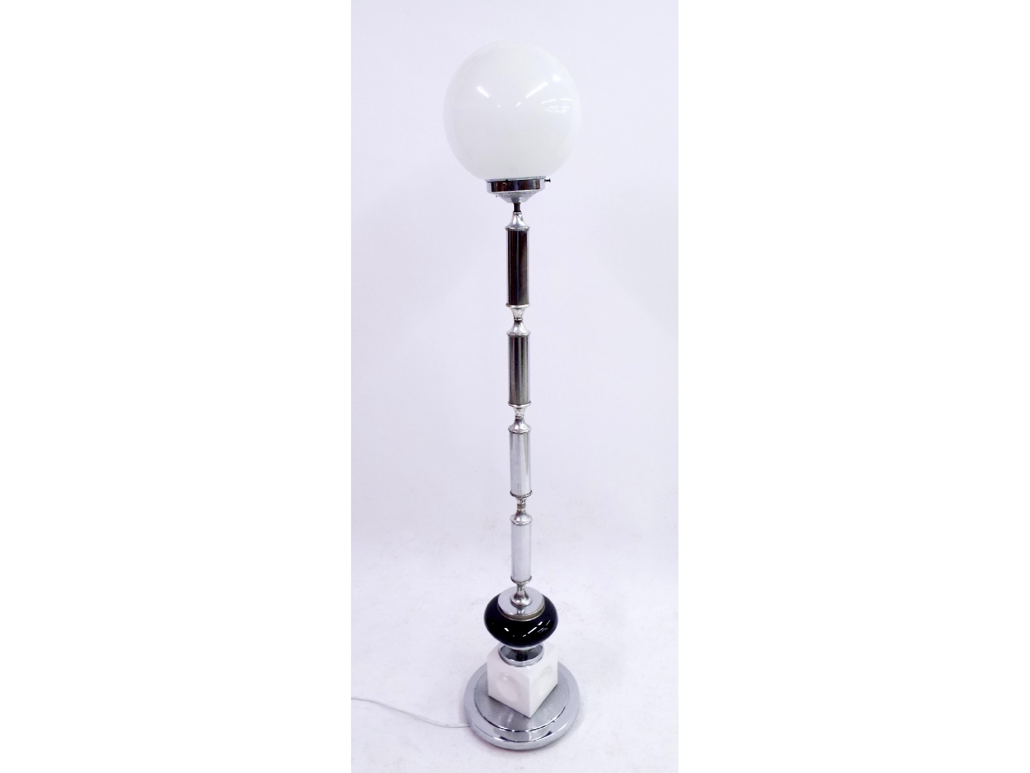 Appraisal: Art Deco chrome standard lamp upon a black and white