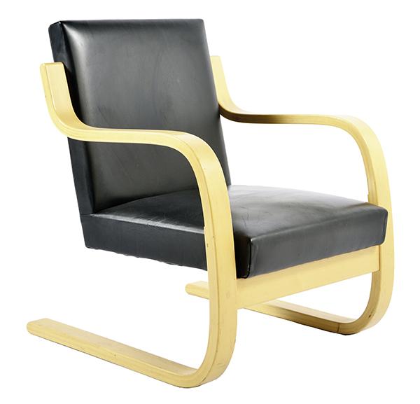 Appraisal: AN ALVAR AALTO ARMCHAIR Finland Manufactured by Artek Cantilevered birch