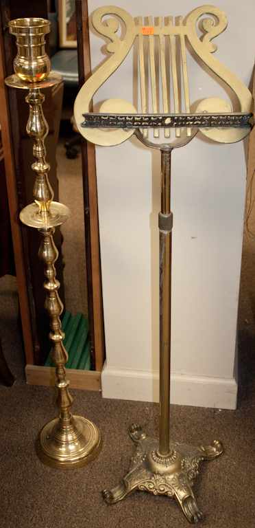 Appraisal: Brass altar candlestick and a brass music stand Estimate -