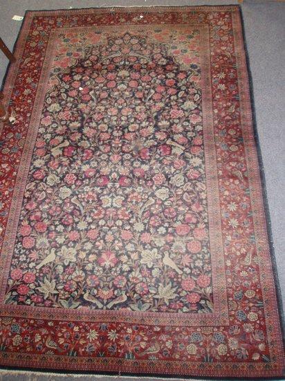 Appraisal: A bordered and figured Keshan prayer rug of dark blue