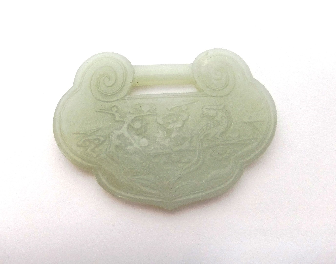 Appraisal: A Chinese pale celadon jade buckle th th century of