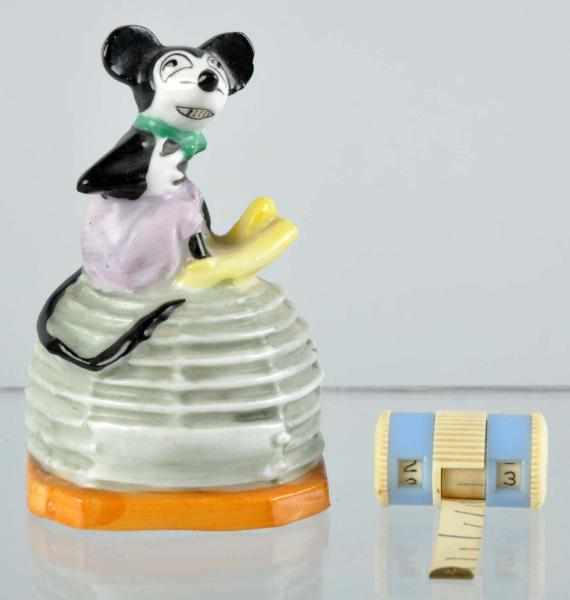 Appraisal: China Walt Disney Mickey Beehive Tape Measure Description Marked Foreign