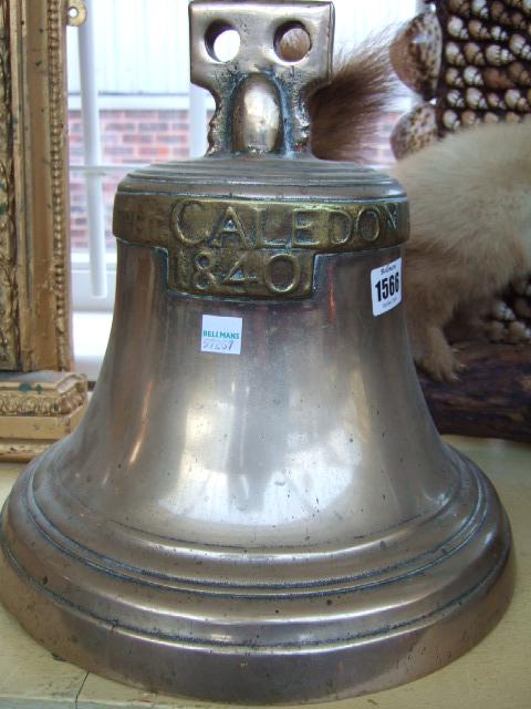 Appraisal: A brass ships bell detailed 'Skeppet Caledonia ' cm high