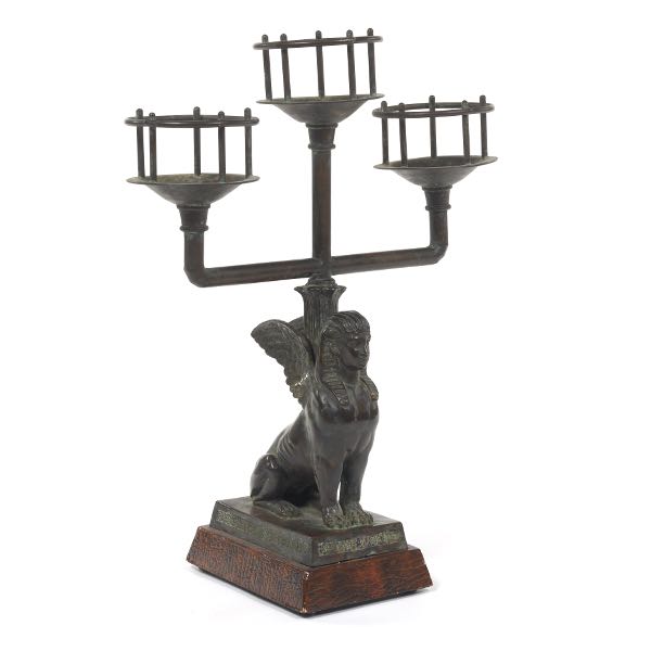 Appraisal: EGYPTIAN REVIVAL SPHINX CANDELABRA x x Cast metal with bronze