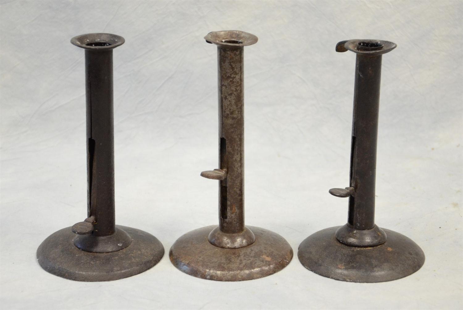 Appraisal: Tin push-up hogscraper candlesticks all signed with original clips wonderful