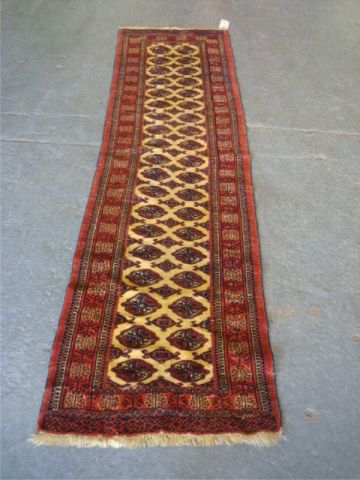 Appraisal: Handmade ivory Bokhara runner Dimensions ' x '