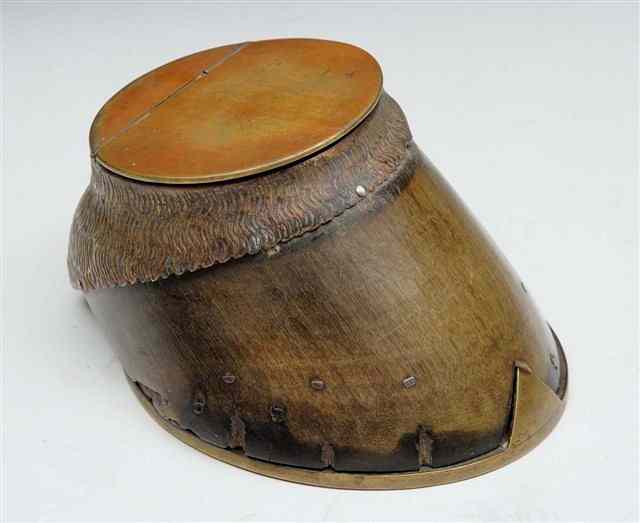 Appraisal: A VICTORIAN HORSES HOOF INK WELL with brass mounts and