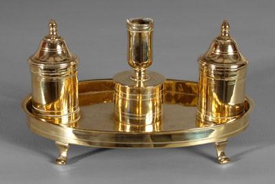 Appraisal: Diminutive English brass standish oval platform with four curved feet