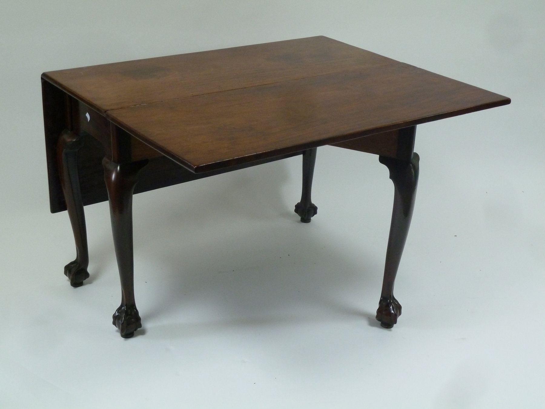 Appraisal: A George II rectangular two-flap table raised on cabriole legs