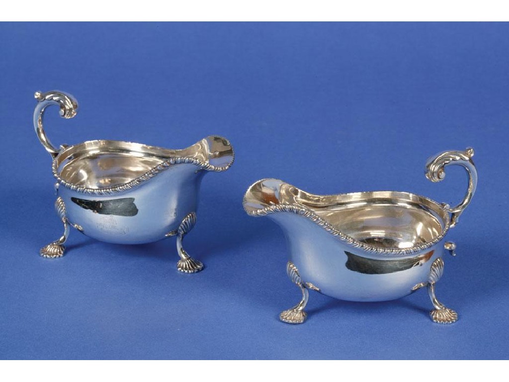 Appraisal: A PAIR OF EDWARDIAN SAUCE BOATS of oval form with