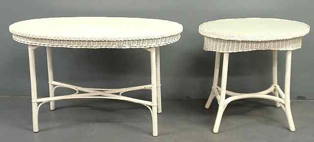 Appraisal: Two oval white wicker tables th c largest h top