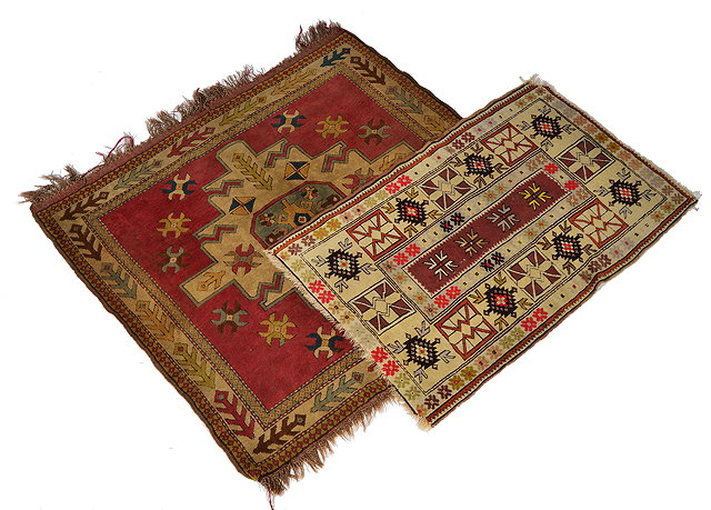 Appraisal: TWO TURKISH TRIBAL RUGS the largest with geometrical medallion on