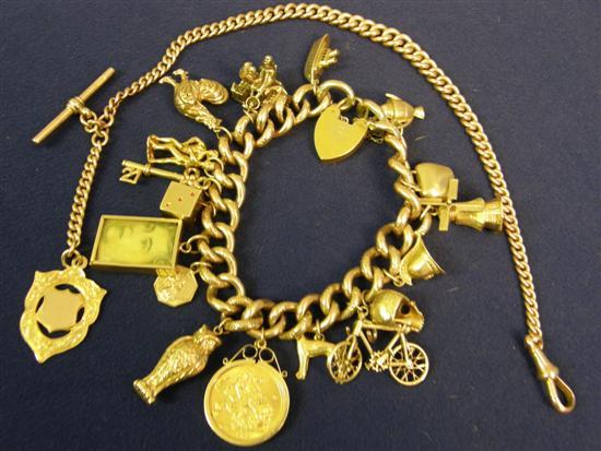 Appraisal: Two items comprising a gold bracelet with attached charms and