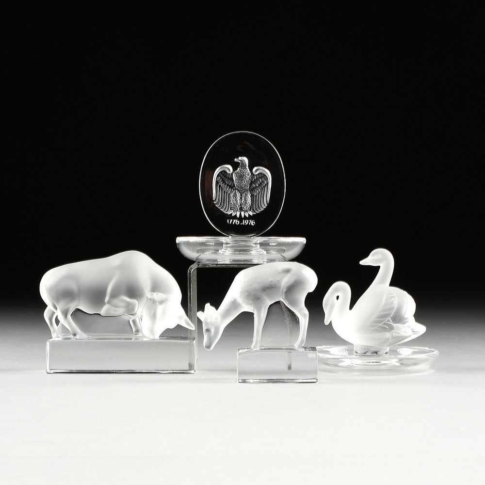 Appraisal: A GROUP OF FOUR LALIQUE CLEAR FROSTED CRYSTAL PAPERWEIGHTS AND