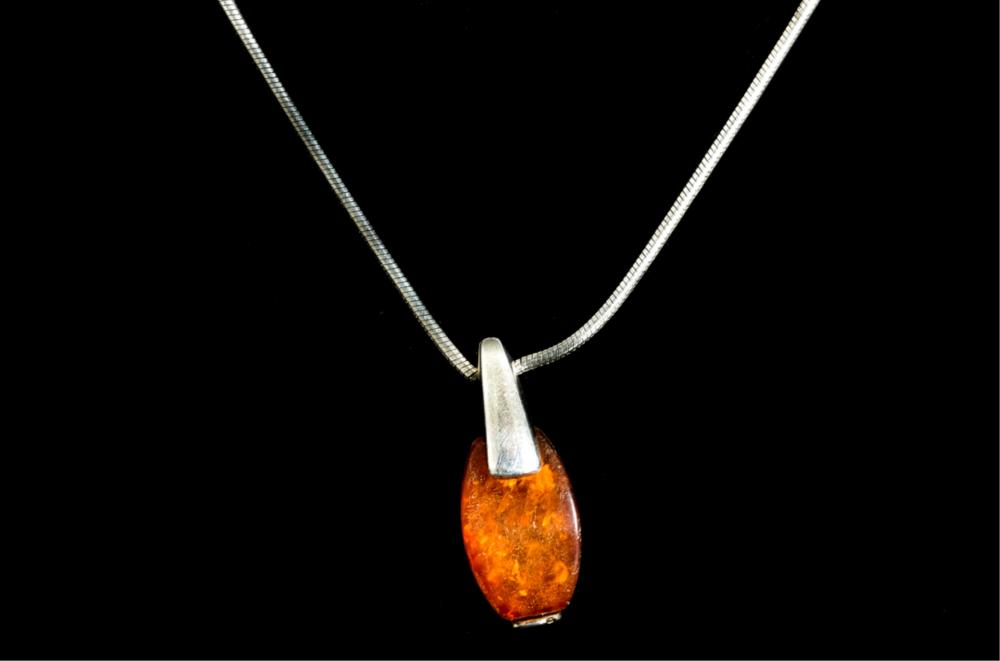 Appraisal: STERLING SILVER AMBER PENDANT NECKLACESterling silver amber pendant necklace Chain