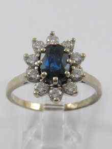 Appraisal: A white metal tests ct gold sapphire and diamond ring