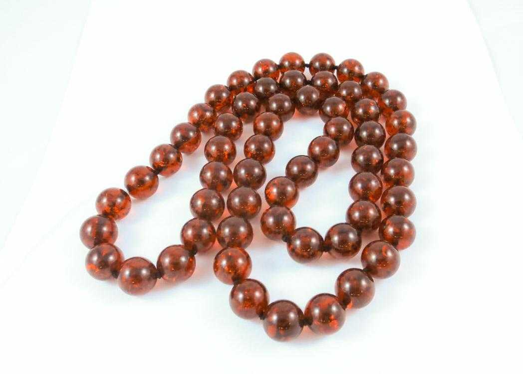 Appraisal: BALTIC PRESSED AMBER BEAD NECKLACE measuring - inches in length