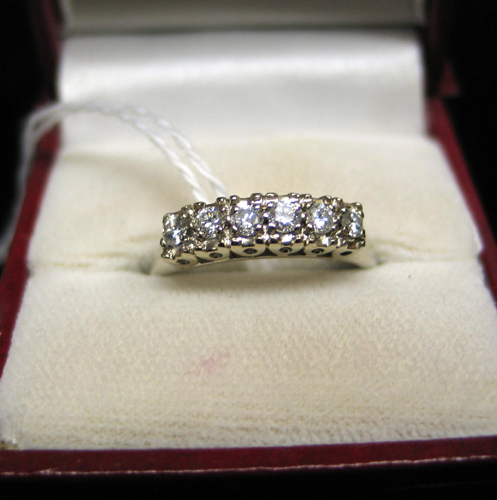 Appraisal: DIAMOND AND FOURTEEN KARAT WHITE GOLD RING set with round