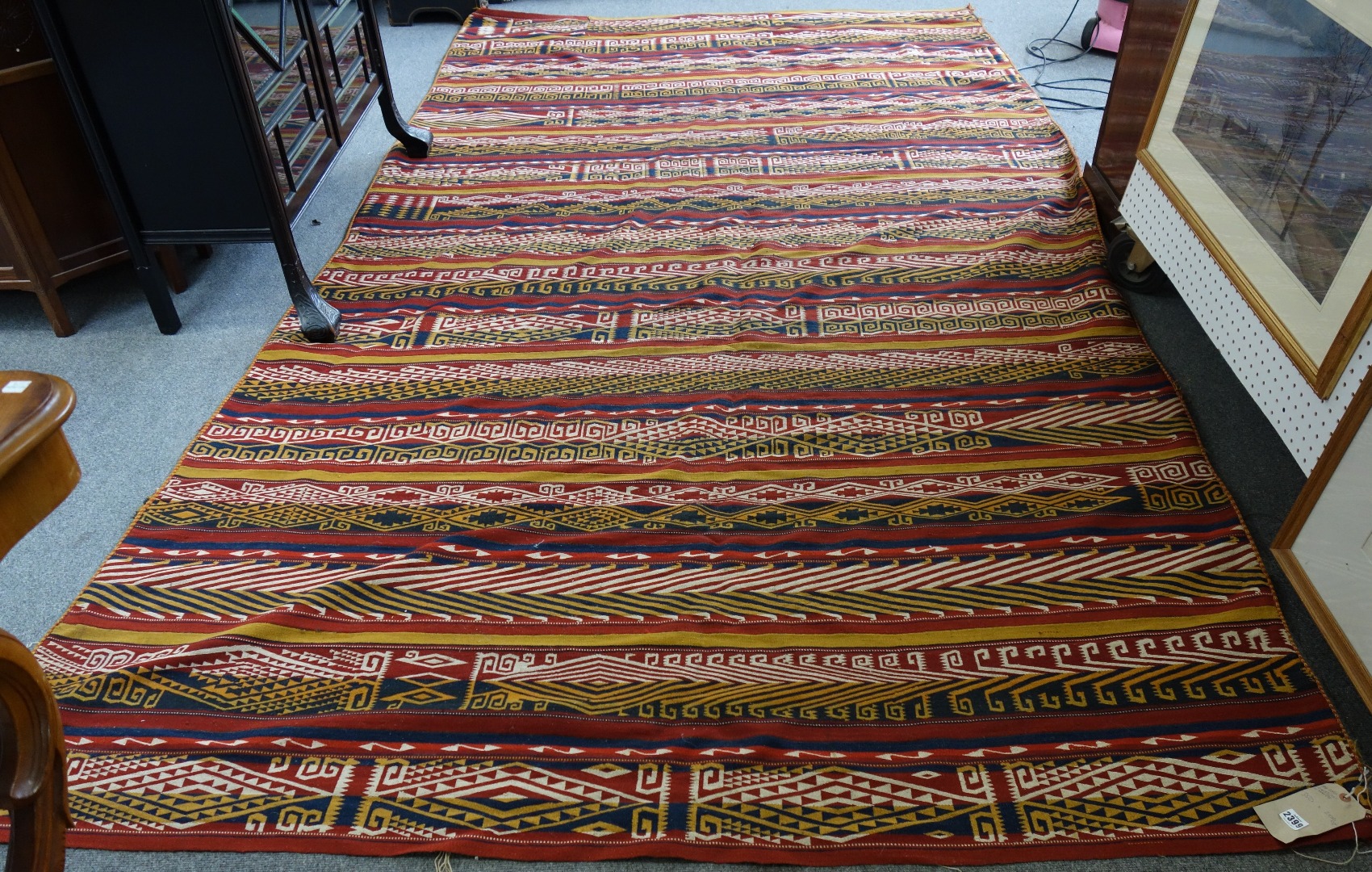 Appraisal: A tribal kelim woven with bands of stylised design x