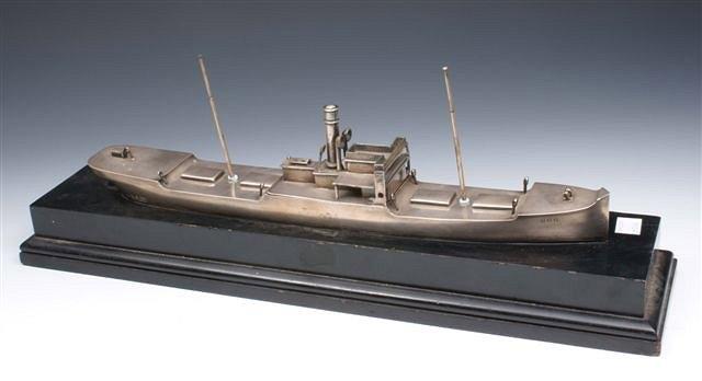 Appraisal: A SILVER MATCH STRIKER IN THE FORM OF A SHIP