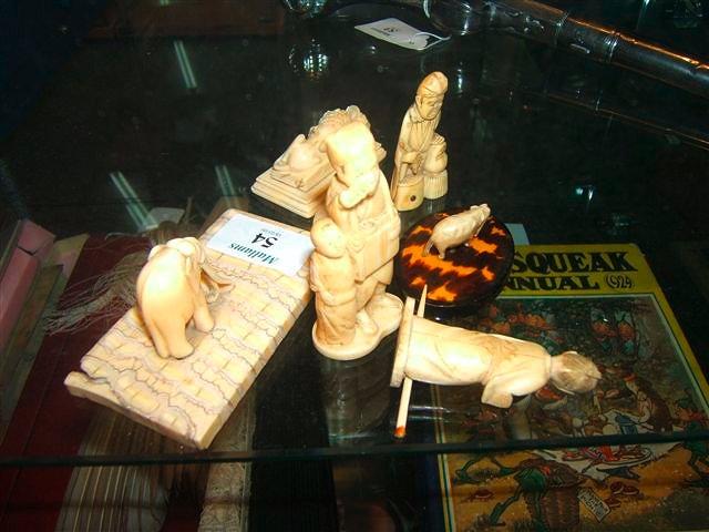 Appraisal: A carved ivory elephant on a rectangular elephant tooth base