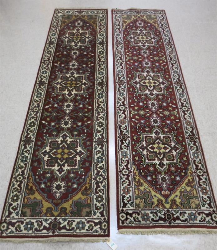 Appraisal: TWO VERY SIMILAR HAND KNOTTED ORIENTAL RUNNERS Indo-Persians floral and