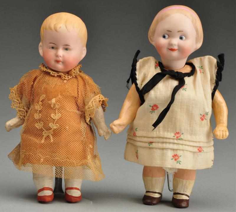 Appraisal: Lot of German Bisque Dolls Description Googly with head incised