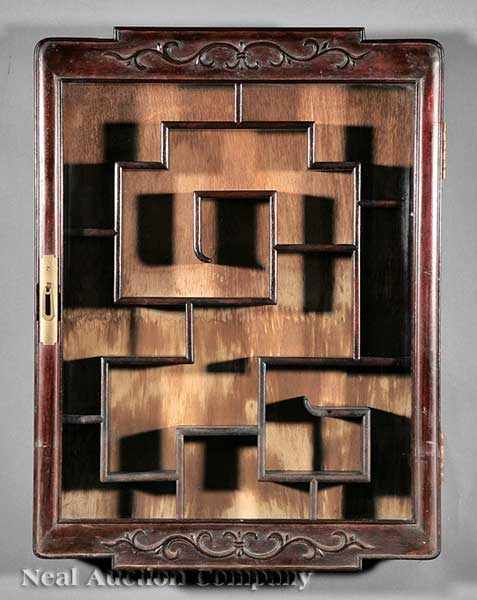 Appraisal: A Chinese Carved Hardwood Hanging Display Cabinet single glazed door