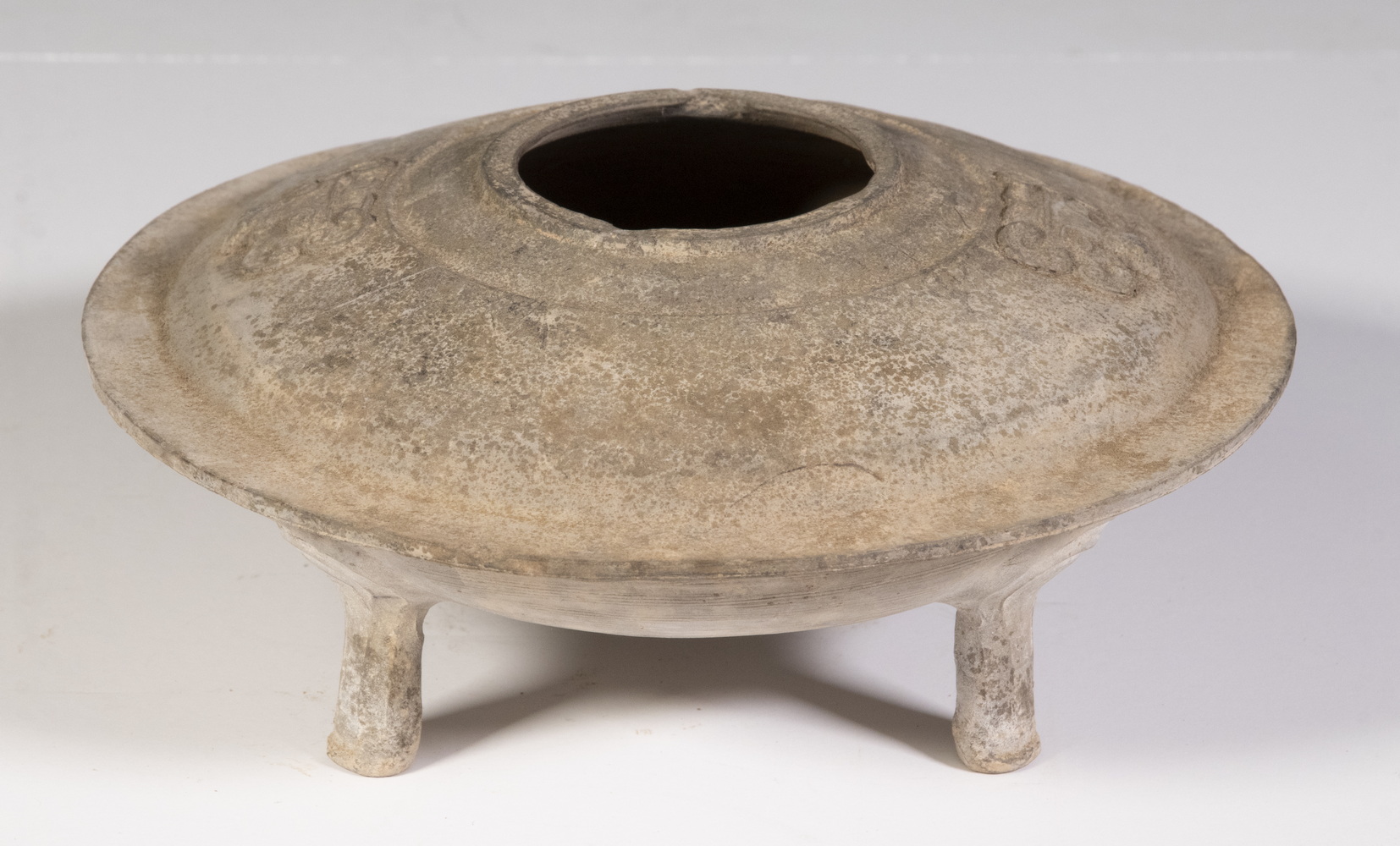 Appraisal: CHINESE HAN DYNASTY FOOTED POTTERY CENSER Flanged Bulging Disc Form