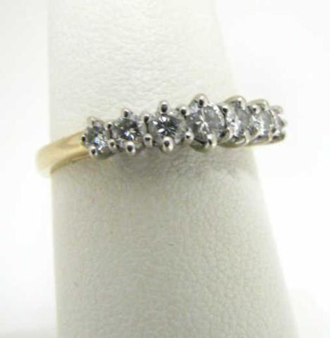 Appraisal: Lady's K yellow gold diamond anniversary ring with round diamonds