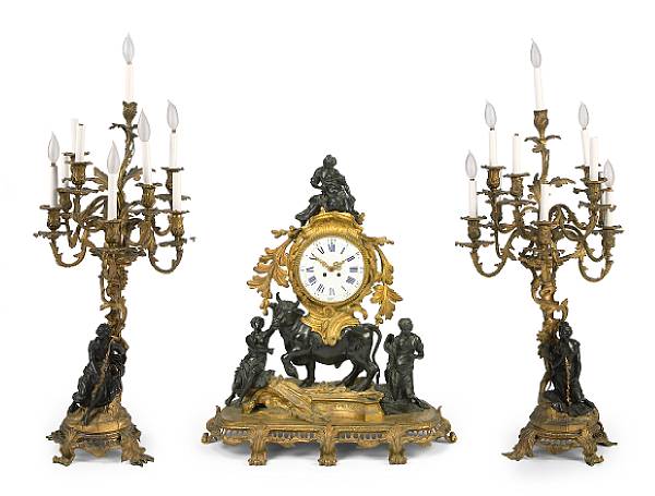 Appraisal: A French gilt and patinated bronze clock garniture late th