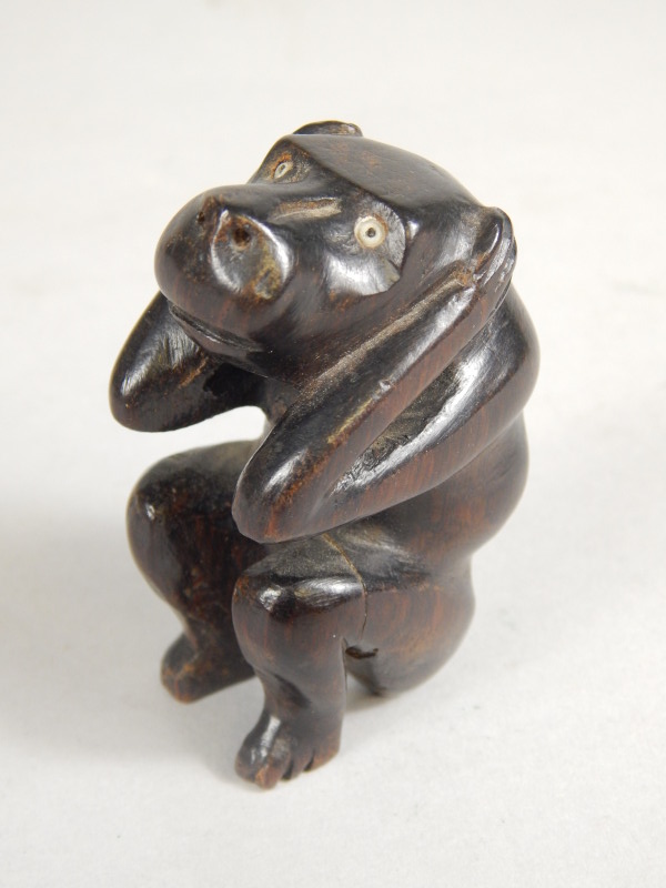 Appraisal: Tribal Art A carved hardwood figure of a monkey hear