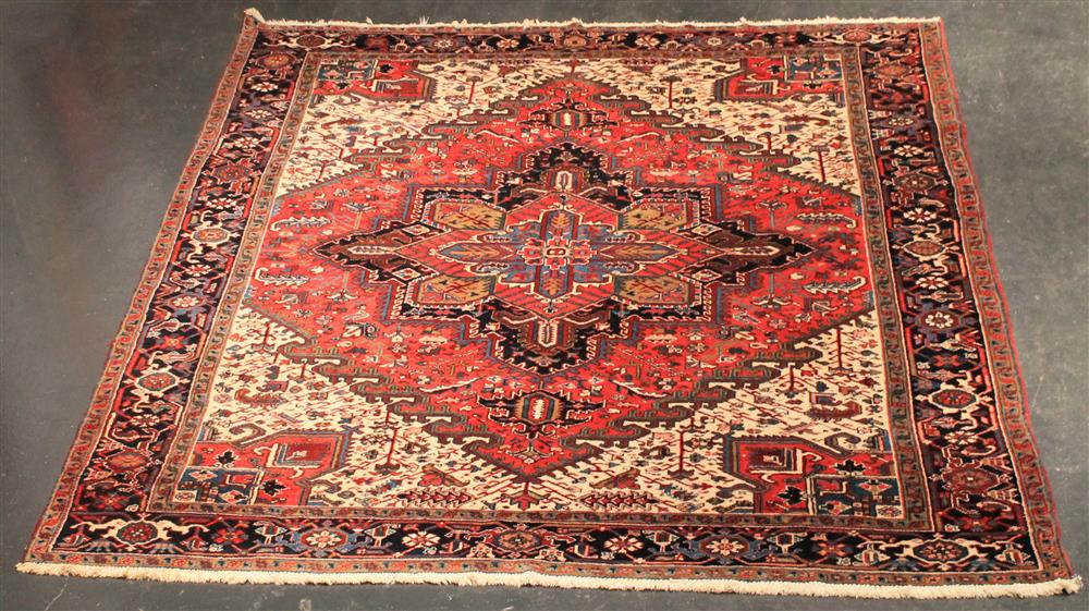 Appraisal: PERSIAN HERIZ RUG central medallion set within a diamond with