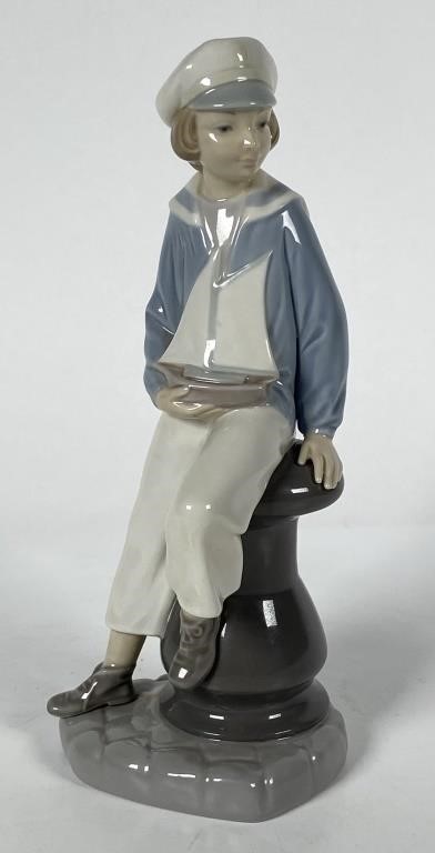 Appraisal: Retired Lladro figurine by Salvador Furio called BOY WITH YACHT