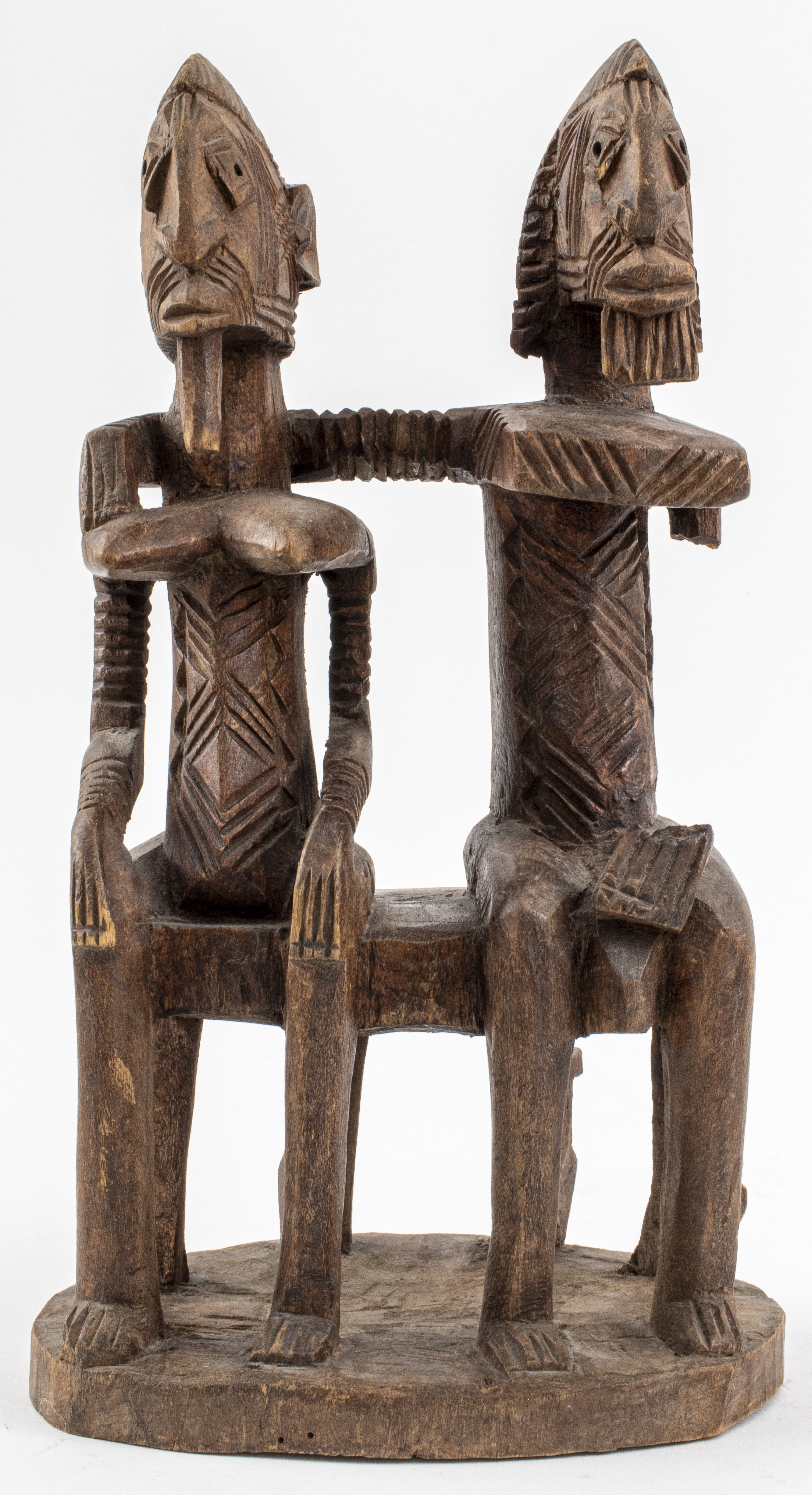 Appraisal: DOGON CARVED WOODEN SCULPTURE OF SEATED COUPLE African Dogon people